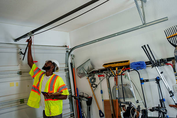 Professional Garage Door Spring Repair technician working in Montmorency County County, MI